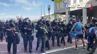 Protester in LA F's around with riot cops, immediately finds out when the projectiles start flying