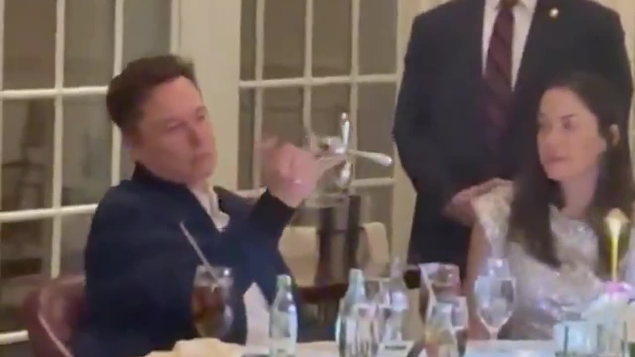 Elon Musk playing with cutlery