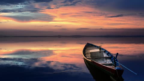 Beautify Your Screen with a Peaceful Sunset Boat – Stunning 2K Wallpaper