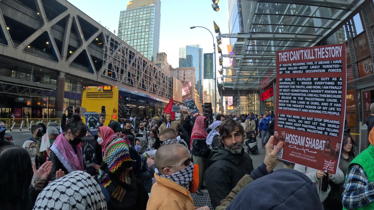 "RALLY IN HONOR OF HOSSAM SHABAT" in front of The New York Times.
