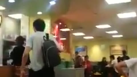 A Chinese man launches racist slur on a woman and husband steps up...!!