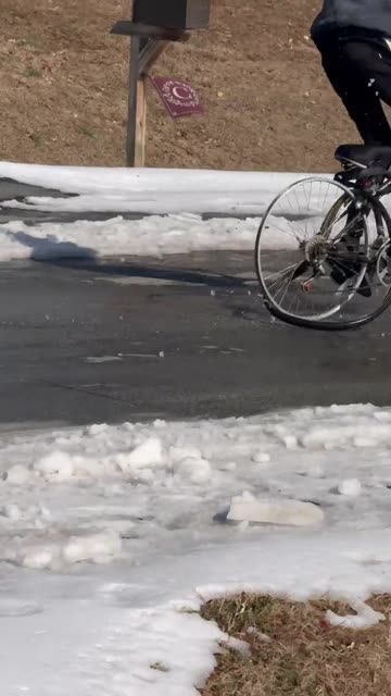 Riding a Bicycle in the Snow With No Tires