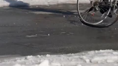 Riding a Bicycle in the Snow With No Tires