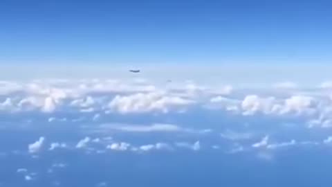 Russian Su-27, politely requesting for a NATO F-15 to move the fuck away from a Russian X Tu-22M.