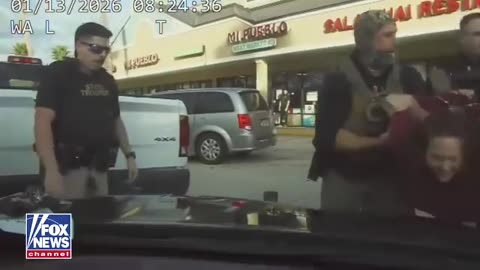 WATCH: Smiling, swinging, and under arrest