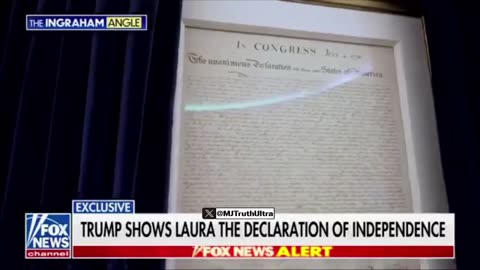 Trump shows off the Declaration of Independence hiding behind a curtain