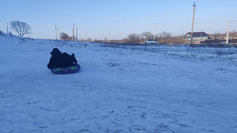 Sledding Man Slides Into Pole
