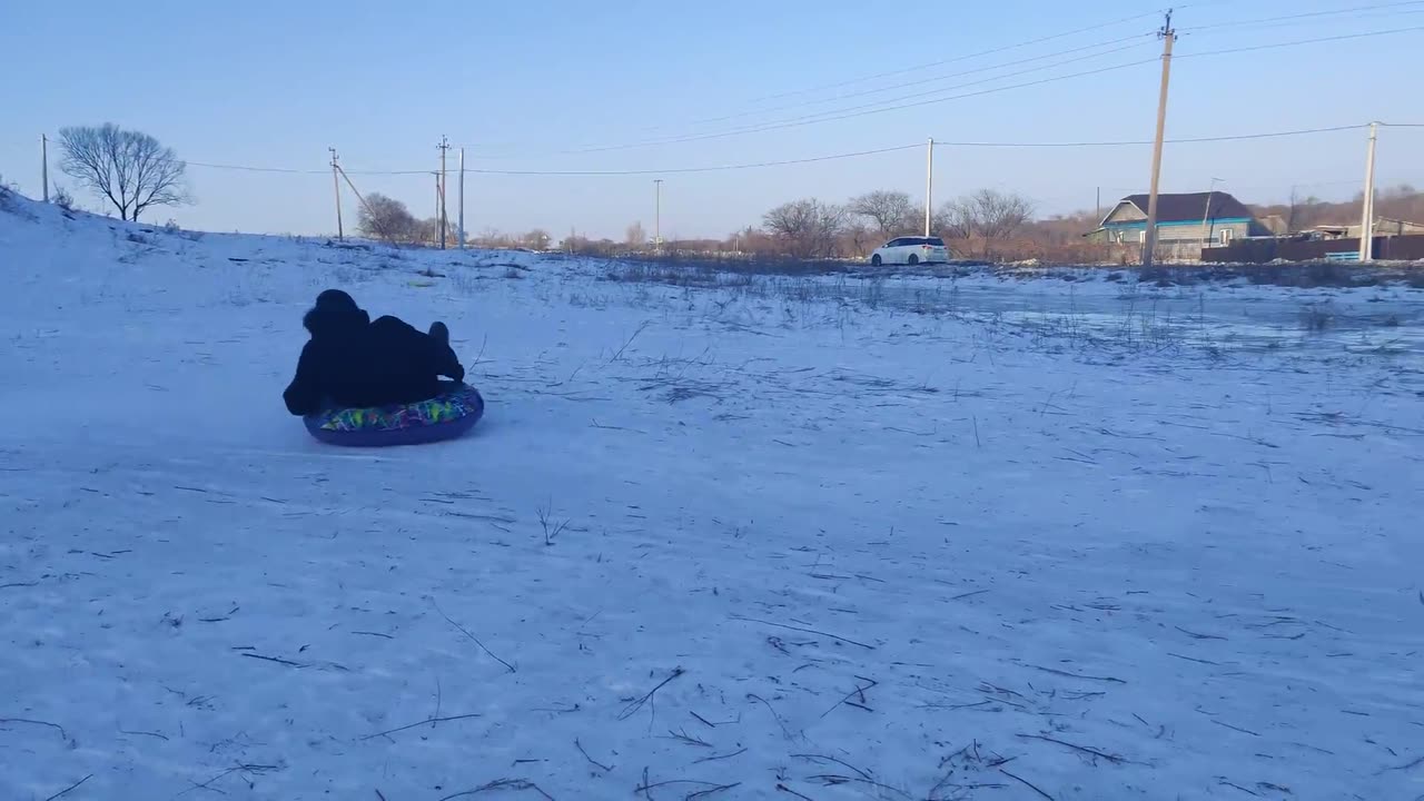 Sledding Man Slides Into Pole