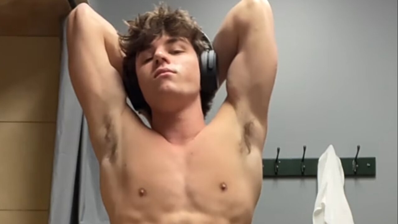 16 years old bodybuilder flexing muscles