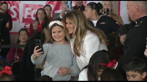 First Lady Melania Trump Happily Takes Selfies With Children At Toys For Tots Event