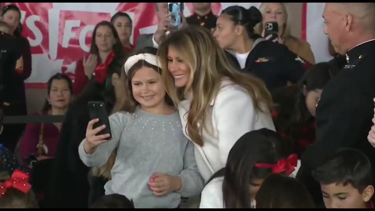 First Lady Melania Trump Happily Takes Selfies With Children At Toys For Tots Event