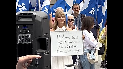 WOMAN HOLDS SIGN SAYING “ISLAM IS NOT WELCOME HERE”