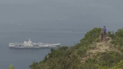 Chinese aircraft carrier sails into Hong Kong for first time