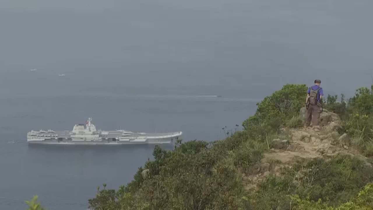 Chinese aircraft carrier sails into Hong Kong for first time
