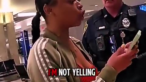 negress gets a free ride out of the Airport in cuffs lol