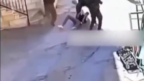 Footage shows Israeli occupation forces brutally assaulting a Palestinian young man