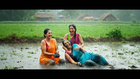 Womans are playing in the village mud
