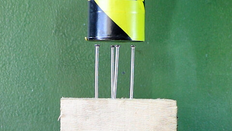 Hydraulic Press Crushing Nails In Wood