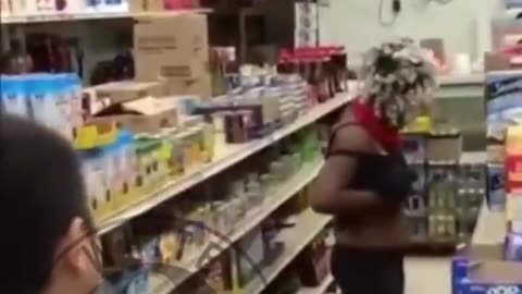 negress shoplifter fights Asian store clerk