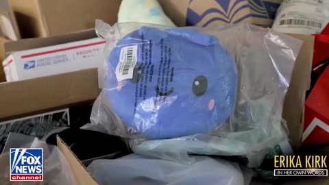 Erika Kirk showing her daughter the gifts left at Charlie Kirk memorial.