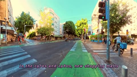 Cycling down Dizengoff Street in Tel Aviv
