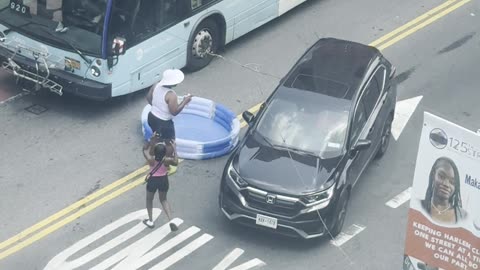 Inflatable Pool In the Middle of an NYC Street