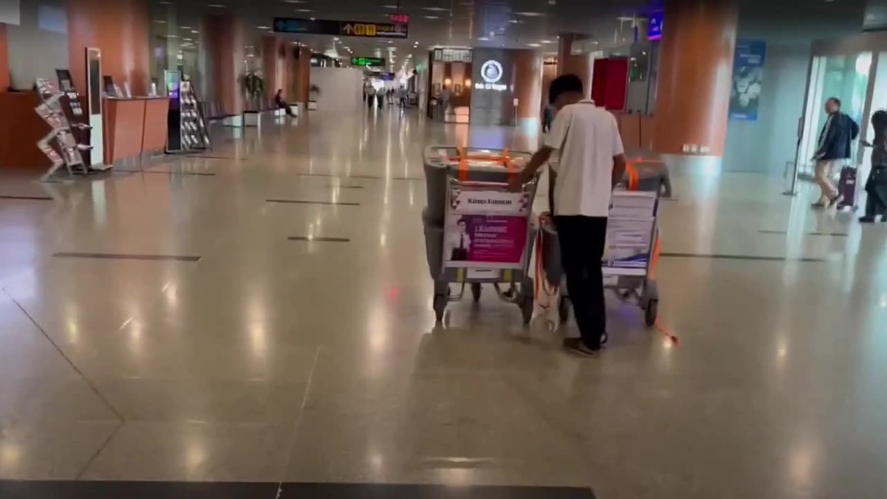 Joe is walking through the Bangkok airport on his way to Myanmar
