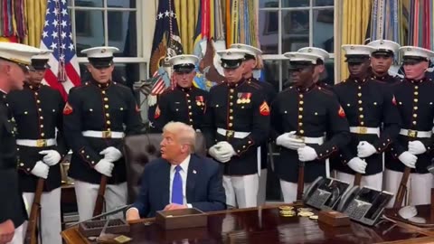 Trump personally hands each member of the Marine Corps Drill Platoon a presidential challenge coin