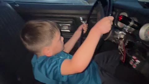 Boy Doing Burnouts in Dad's Car