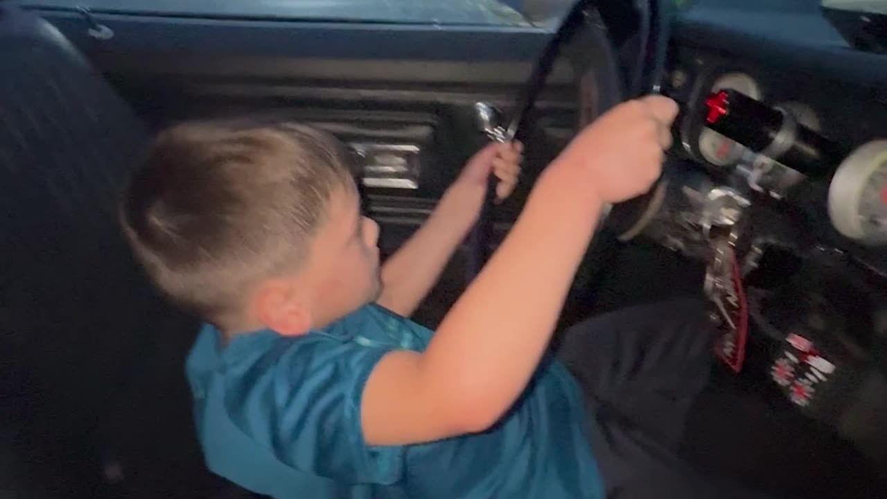 Boy Doing Burnouts in Dad's Car