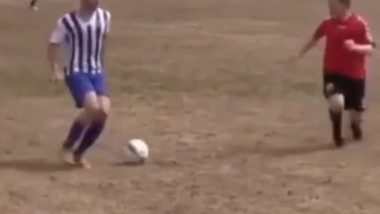Weirdest tackle in football—genius or genuine fall? ⚽😂 Watch and decide! #FootballFails