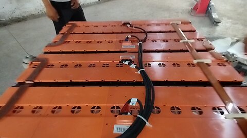 In this video, they are repairing an electric car battery."