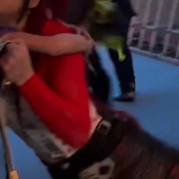 Iyo Sky letting fans touch her belt after her wrestlemania win against Rhea Ripley & Bianca Belair