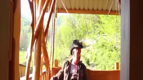 Building a house near a cliff in the forest