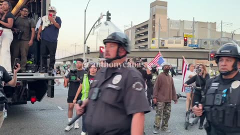 LAPD in riot gear CATCHES up with Protest Truck