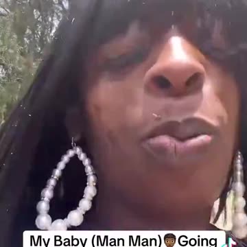 sheboon w/ no teeth excited about childs graduation,she got her wig on!)