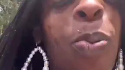 sheboon w/ no teeth excited about childs graduation,she got her wig on!)