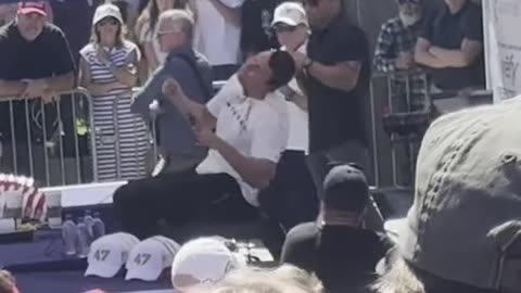 Two bullets coming from behind Charlie Kirk