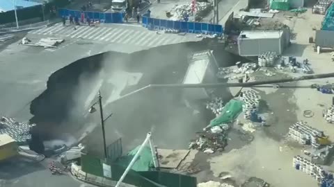 NEW - Huge sinkhole swallows major stretch of roadway in Shanghai, China.