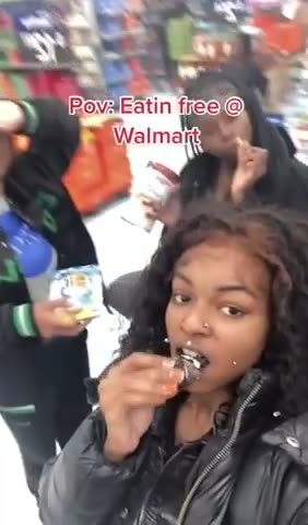 Sheboon Nigger Teaches Its Niglet How To Steal From Walmart