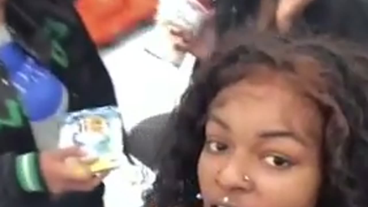 Sheboon Nigger Teaches Its Niglet How To Steal From Walmart