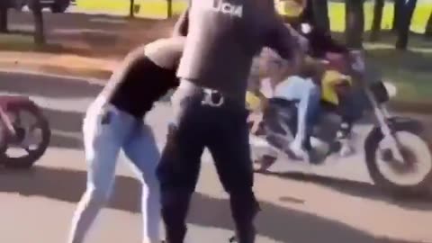 Woman slaps cop..