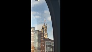 English flag on top of a church building in Limehouse east London