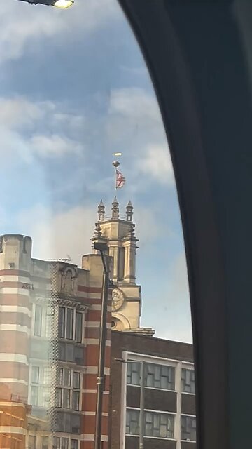 English flag on top of a church building in Limehouse east London
