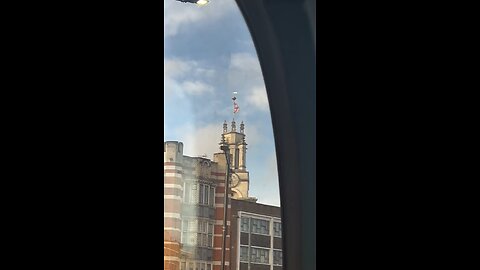 English flag on top of a church building in Limehouse east London
