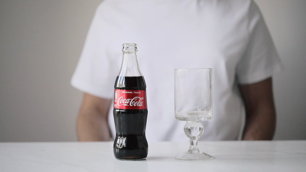 pouring cocoa cola drink