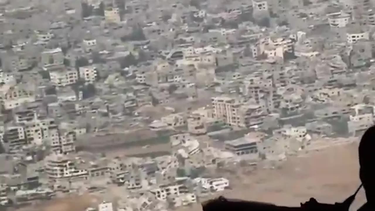 Aerial view shows entire Gaza neighborhoods reduced to rubble by Israeli air strikes.