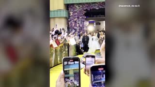 Fan rushes at Ariana Grande during premiere in Singapore