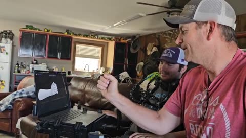 Alex controls a virtual robot hand with his mind to play rock, paper, scissors against his uncle