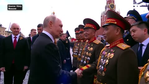 Putin Embraces North Korean General In Red Square